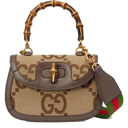 Gucci Bamboo 1947 in off-white and ivory jumbo GG canvas with ivory leather trim, available at Luxury LD